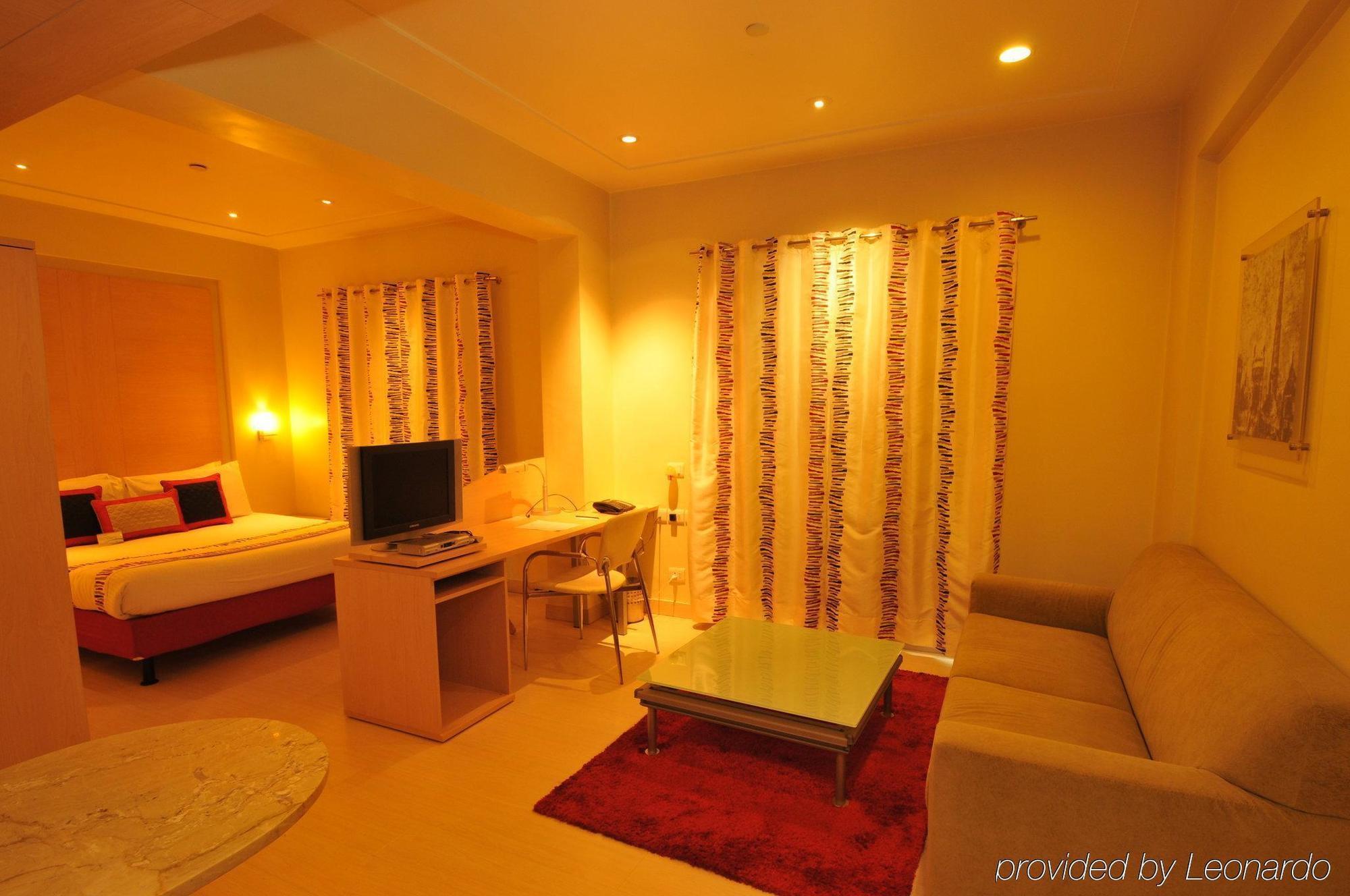 Avalon Courtyard Residence Suites Νέο Δελχί Δωμάτιο φωτογραφία